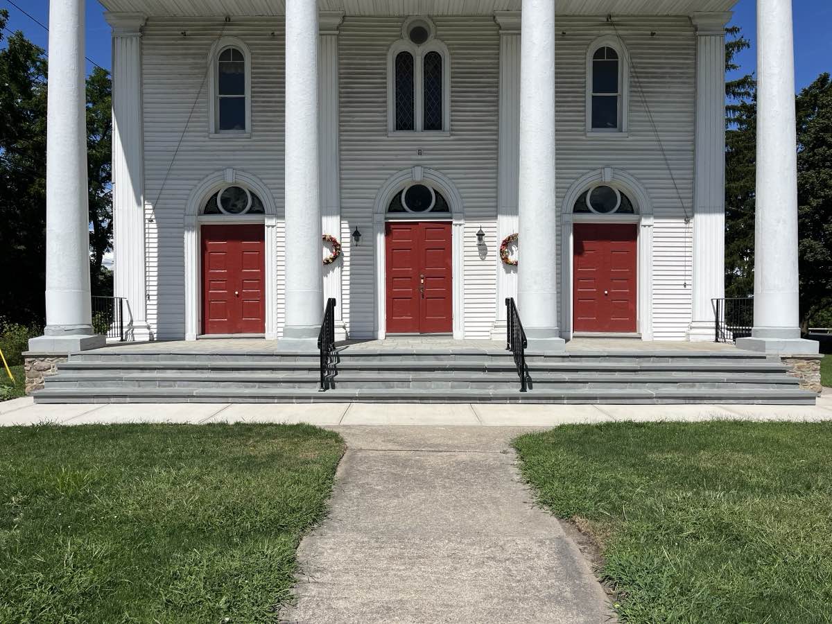 Rebuilt concrete steps at the front of a historic church