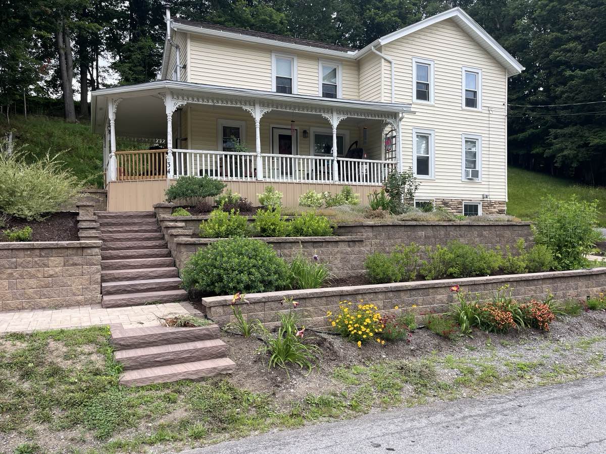 Terraced retaining walls with landscaping on a slope